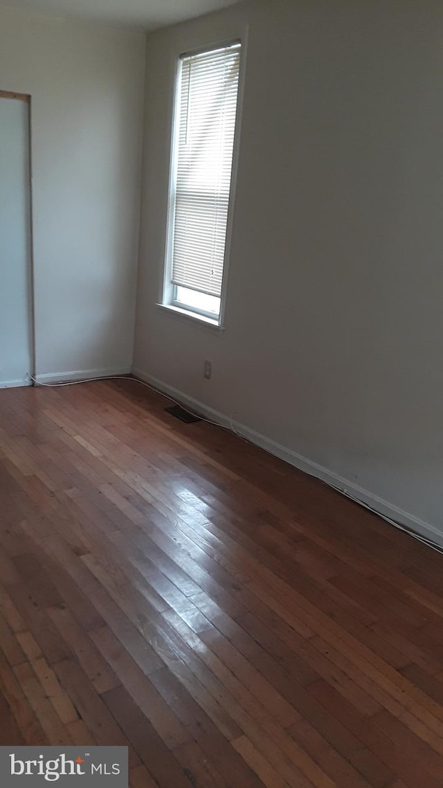 2523 Garrett Ave, Baltimore, MD 21218 - unfurnished room featuring hardwood / wood-style flooring and baseboards