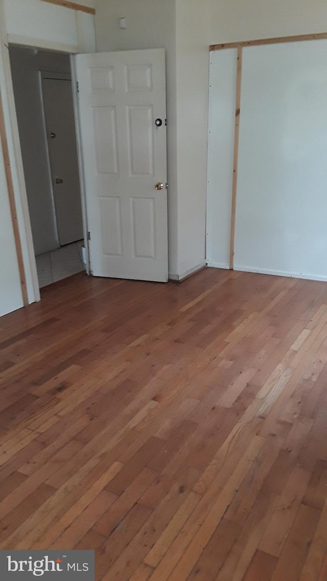 2523 Garrett Ave, Baltimore, MD 21218 - unfurnished bedroom featuring light wood-style floors