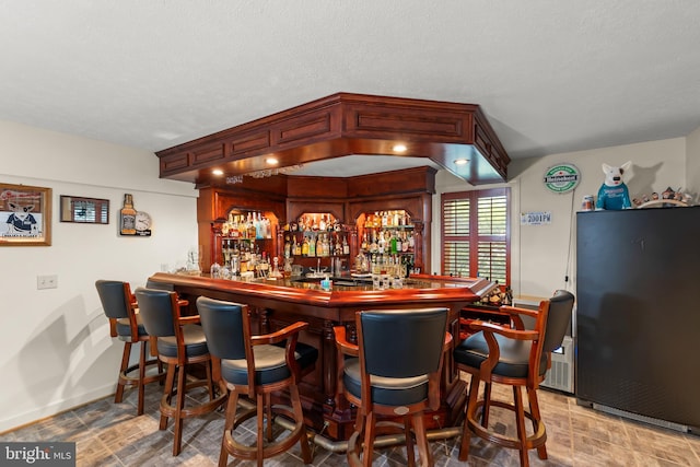 1419 Ramseur Ln, Winchester, VA 22601 - indoor dry bar with freestanding refrigerator and baseboards