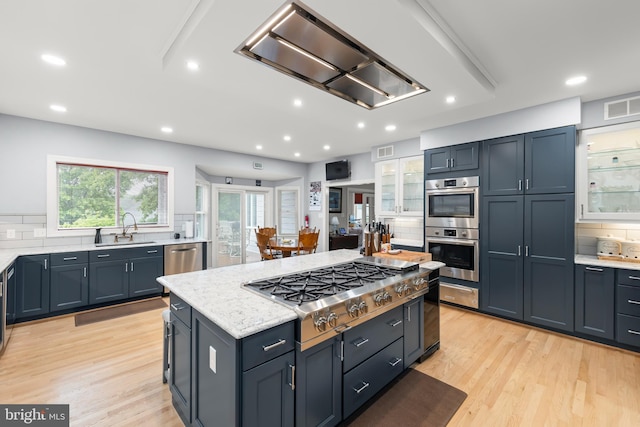 1419 Ramseur Ln, Winchester, VA 22601 - kitchen with stainless steel appliances, a sink, exhaust hood, tasteful backsplash, and recessed lighting