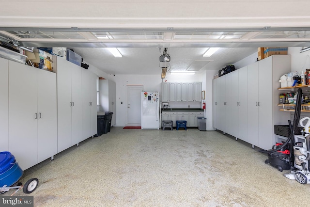 1419 Ramseur Ln, Winchester, VA 22601 - garage featuring freestanding refrigerator and a garage door opener