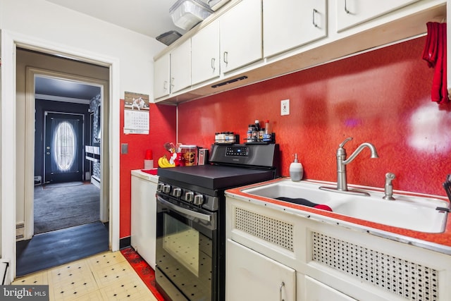 232 Columbia Ave, Trenton, NJ 08618 - kitchen with black electric range, a sink, and white cabinetry
