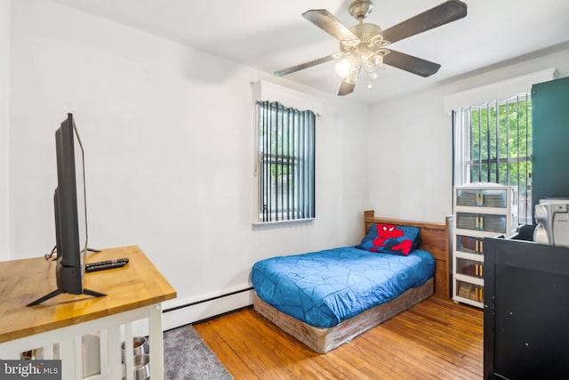 232 Columbia Ave, Trenton, NJ 08618 - bedroom with a baseboard radiator, wood finished floors, and a ceiling fan