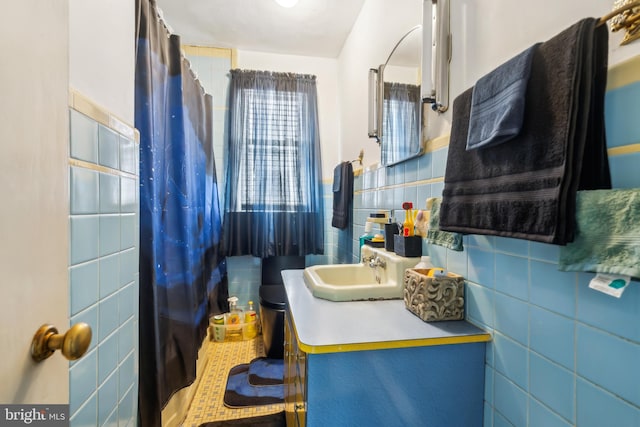 232 Columbia Ave, Trenton, NJ 08618 - bathroom with tile walls, a shower with shower curtain, and vanity