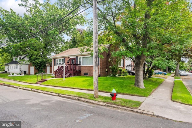 232 Columbia Ave, Trenton, NJ 08618 - view of front of property featuring brick siding and a front lawn