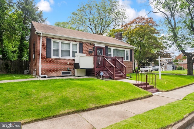232 Columbia Ave, Trenton, NJ 08618 - view of front facade featuring brick siding, a chimney, a front lawn, and a shingled roof