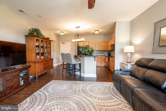 1000 Fountainview Cir Unit 304, Newark, DE 19713 - living room with dark wood finished floors, a chandelier, and baseboards