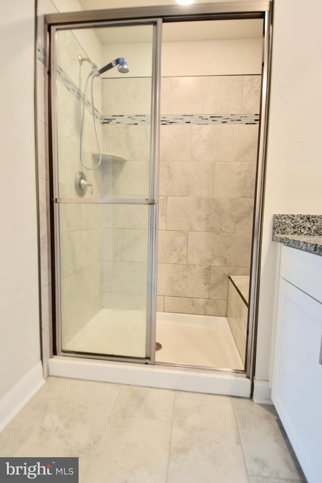 35258 Wright Way, Millsboro, DE 19966 - bathroom with a stall shower, tile patterned flooring, and vanity