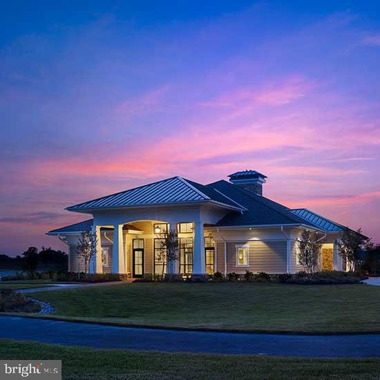 35258 Wright Way, Millsboro, DE 19966 - view of front facade featuring a front yard, a standing seam roof, and metal roof