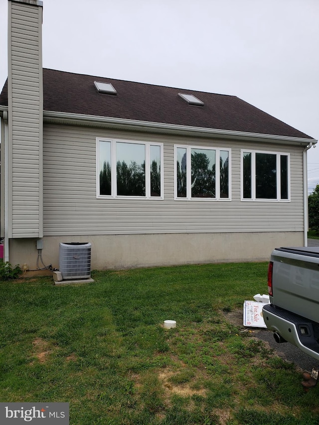 4010 Conowingo Rd, Darlington, MD 21034 - view of property exterior with cooling unit, a lawn, and a chimney