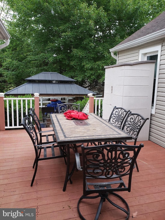 4010 Conowingo Rd, Darlington, MD 21034 - wooden deck with outdoor dining area, a gazebo, and view of scattered trees