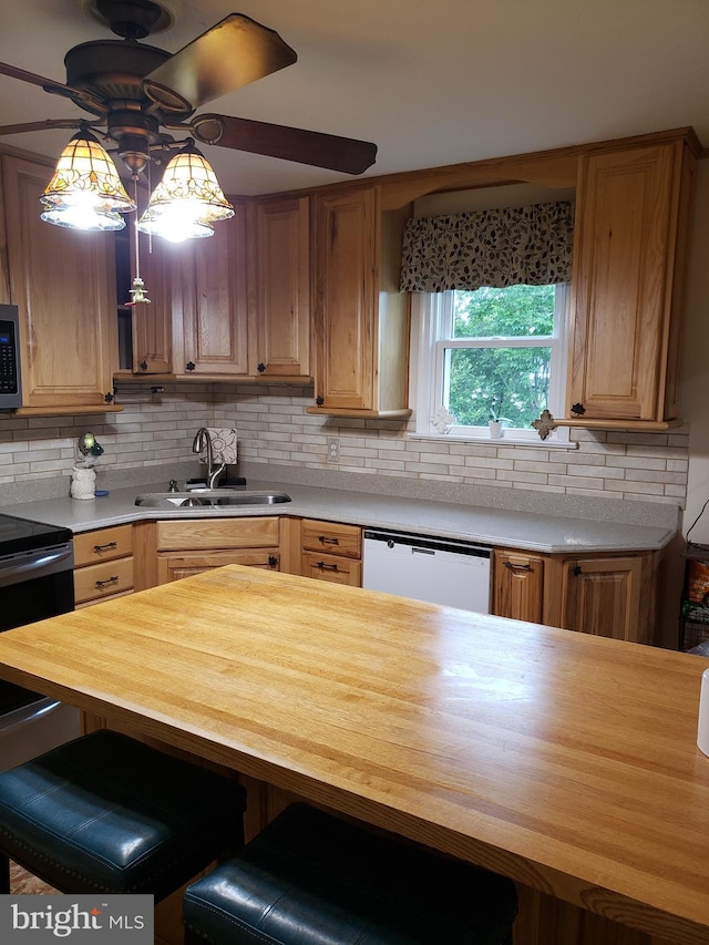 4010 Conowingo Rd, Darlington, MD 21034 - kitchen featuring white dishwasher, a sink, butcher block countertops, a ceiling fan, and stainless steel microwave