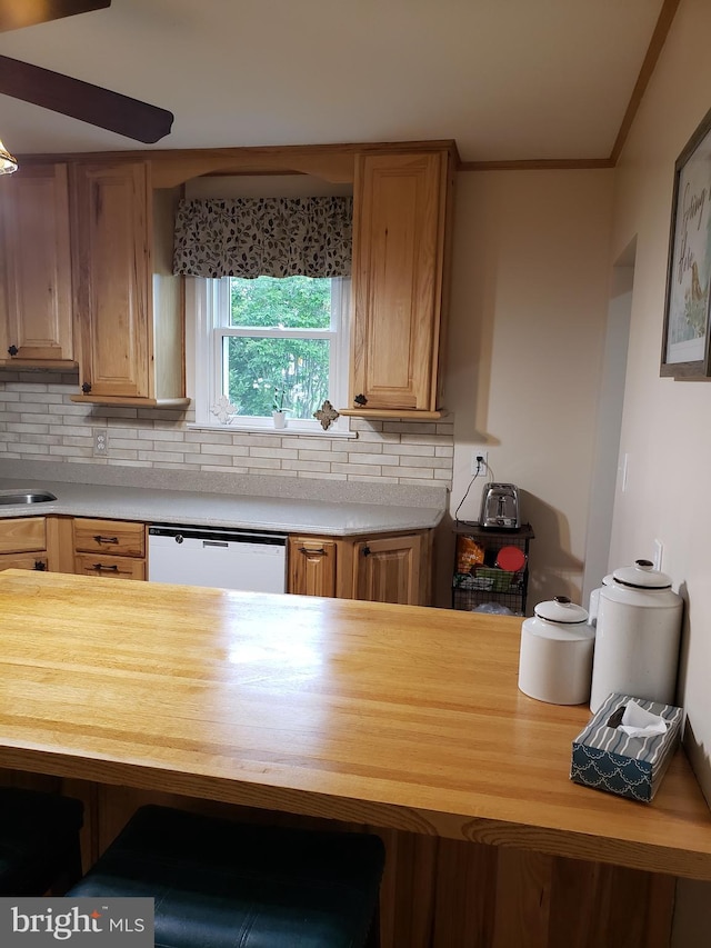 4010 Conowingo Rd, Darlington, MD 21034 - kitchen featuring white dishwasher, butcher block counters, tasteful backsplash, and ornamental molding