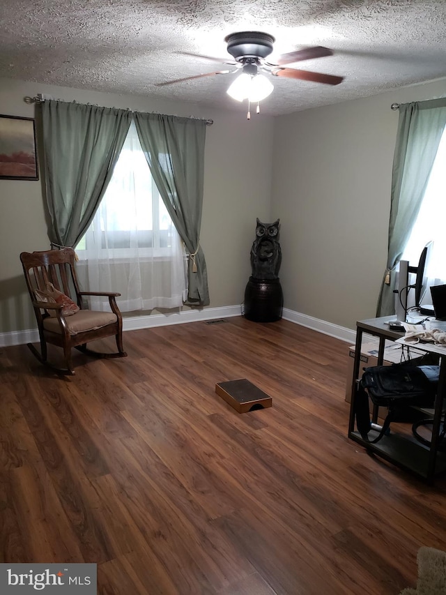 4010 Conowingo Rd, Darlington, MD 21034 - living area featuring ceiling fan, baseboards, wood finished floors, a desk, and a textured ceiling