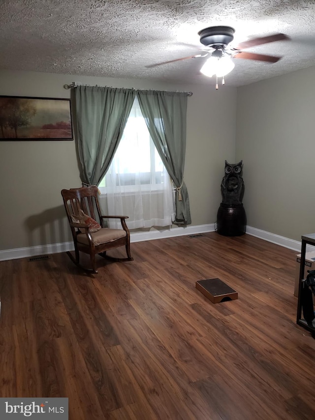 4010 Conowingo Rd, Darlington, MD 21034 - living area with baseboards, a ceiling fan, wood finished floors, and a textured ceiling