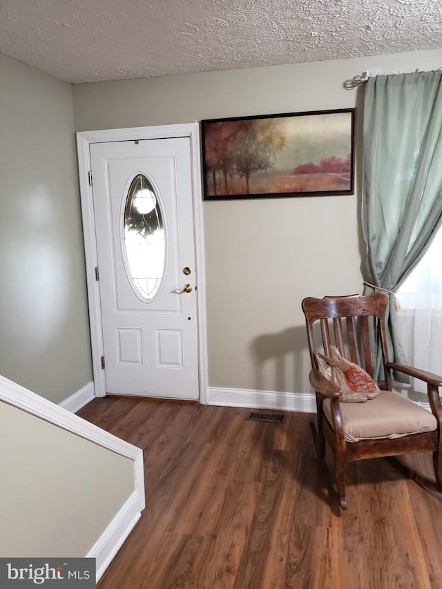 4010 Conowingo Rd, Darlington, MD 21034 - entrance foyer featuring wood finished floors, baseboards, and a textured ceiling