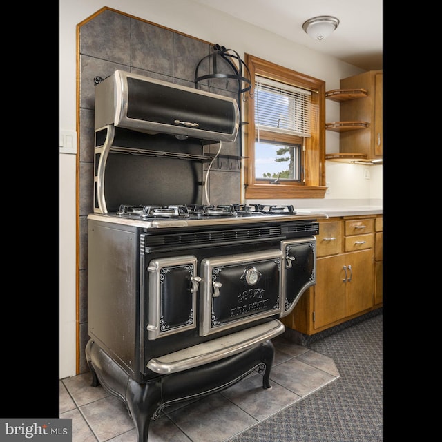 1217 Bullens Ln, Woodlyn, PA 19094 - kitchen featuring brown cabinetry, light countertops, and open shelves