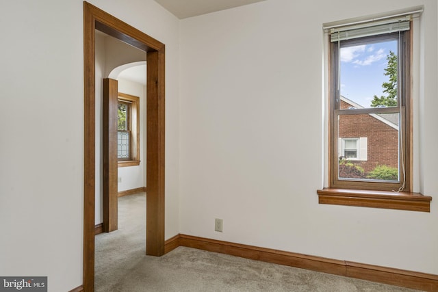 1217 Bullens Ln, Woodlyn, PA 19094 - carpeted spare room featuring arched walkways, plenty of natural light, and baseboards