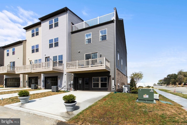 10989 Pinnacle Green Rd, Upper Marlboro, MD 20774 - rear view of house featuring central air condition unit, driveway, and a carport