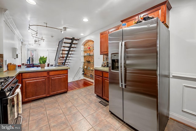 3310 Hudson St, Baltimore, MD 21224 - kitchen featuring stainless steel fridge, range with gas cooktop, light tile patterned floors, light countertops, and recessed lighting