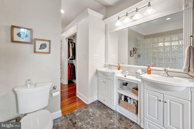 3310 Hudson St, Baltimore, MD 21224 - bathroom featuring double vanity, toilet, marble finish floors, a walk in closet, and recessed lighting