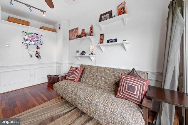 3310 Hudson St, Baltimore, MD 21224 - sitting room with hardwood / wood-style floors, a wainscoted wall, ceiling fan, track lighting, and a decorative wall