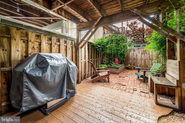 3310 Hudson St, Baltimore, MD 21224 - wooden deck featuring grilling area and a fenced backyard