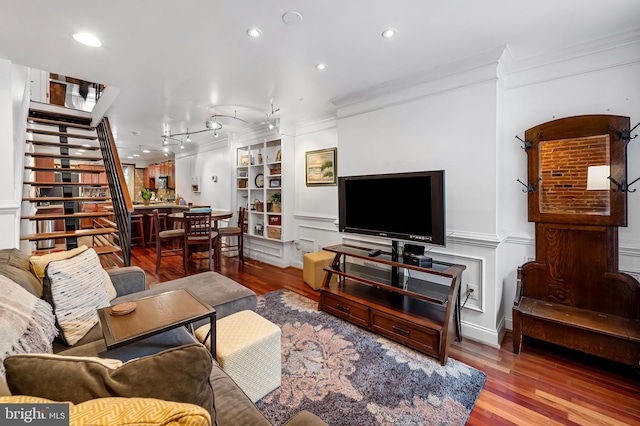 3310 Hudson St, Baltimore, MD 21224 - living area with crown molding, wood finished floors, stairs, recessed lighting, and built in shelves