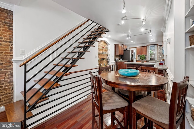 3310 Hudson St, Baltimore, MD 21224 - dining space featuring wood finished floors and stairway