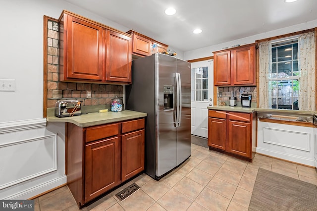 3310 Hudson St, Baltimore, MD 21224 - kitchen featuring stainless steel fridge with ice dispenser, backsplash, light tile patterned flooring, light countertops, and recessed lighting