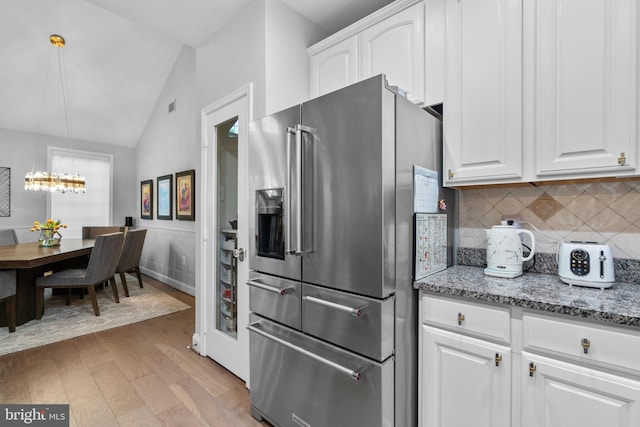 8820 Shining Oceans Way Unit 407, Columbia, MD 21045 - kitchen featuring high end fridge, light wood-type flooring, backsplash, a chandelier, and white cabinetry