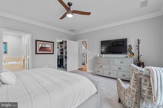 8820 Shining Oceans Way Unit 407, Columbia, MD 21045 - carpeted bedroom with ornamental molding, a spacious closet, a closet, ensuite bathroom, and ceiling fan