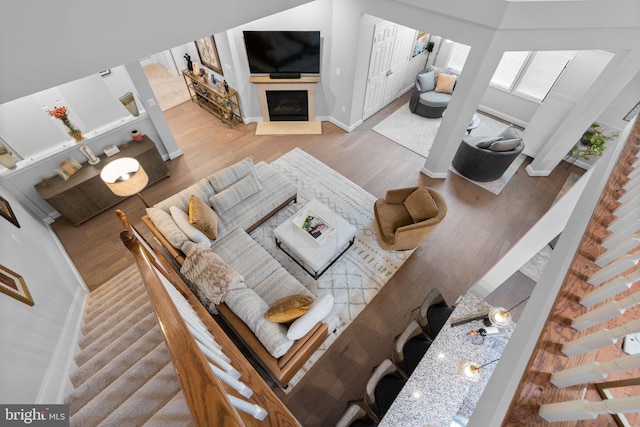 8820 Shining Oceans Way Unit 407, Columbia, MD 21045 - living room featuring wood finished floors and a fireplace