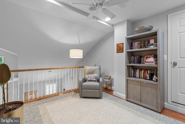 8820 Shining Oceans Way Unit 407, Columbia, MD 21045 - living area with ceiling fan, wood finished floors, and lofted ceiling