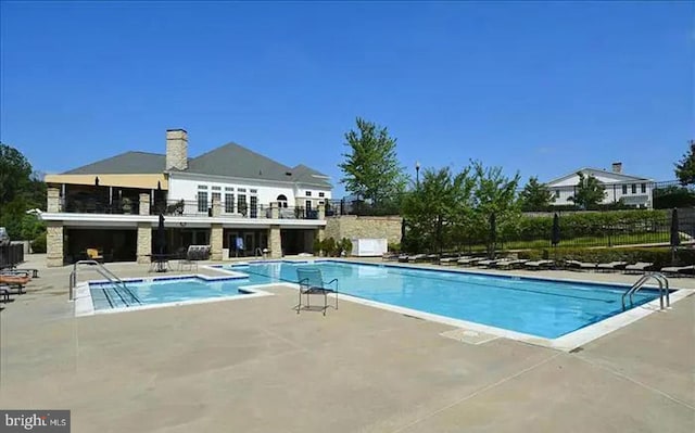 8820 Shining Oceans Way Unit 407, Columbia, MD 21045 - community pool featuring a patio