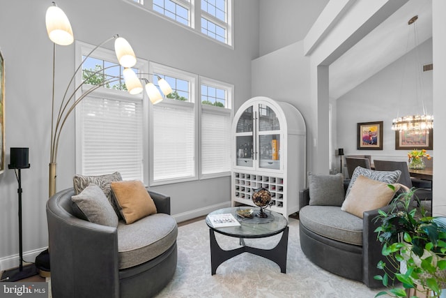 8820 Shining Oceans Way Unit 407, Columbia, MD 21045 - sitting room featuring a chandelier and a towering ceiling