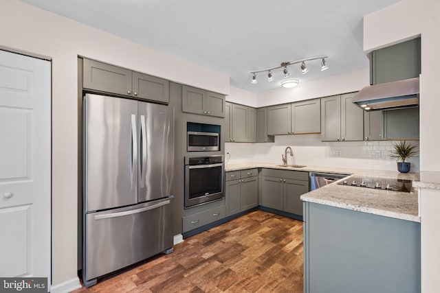 1328 Hollow Glen Ct, Curtis Bay, MD 21226 - kitchen with appliances with stainless steel finishes, gray cabinets, a sink, dark wood finished floors, and backsplash
