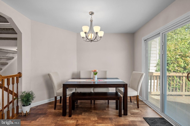 1328 Hollow Glen Ct, Curtis Bay, MD 21226 - dining room with a chandelier, wood finished floors, baseboards, and stairway