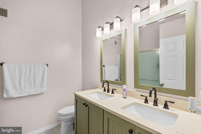 1328 Hollow Glen Ct, Curtis Bay, MD 21226 - full bathroom with double vanity, toilet, tile patterned floors, and baseboards