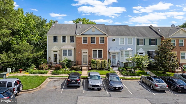 1328 Hollow Glen Ct, Curtis Bay, MD 21226 - view of property with uncovered parking, a chimney, and brick siding