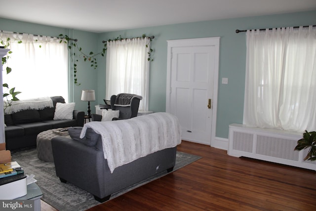 527 N 25th St, Reading, PA 19606 - living room with radiator, wood finished floors, and baseboards