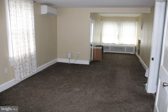 527 N 25th St, Reading, PA 19606 - carpeted spare room with radiator heating unit, an AC wall unit, and baseboards