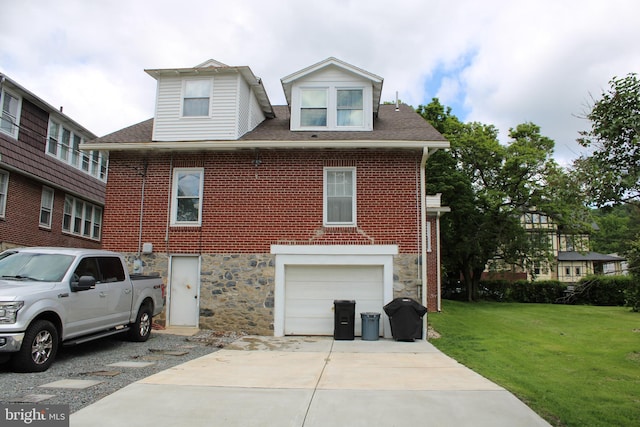 527 N 25th St, Reading, PA 19606 - view of front of house with a garage, a front lawn, driveway, stone siding, and brick siding