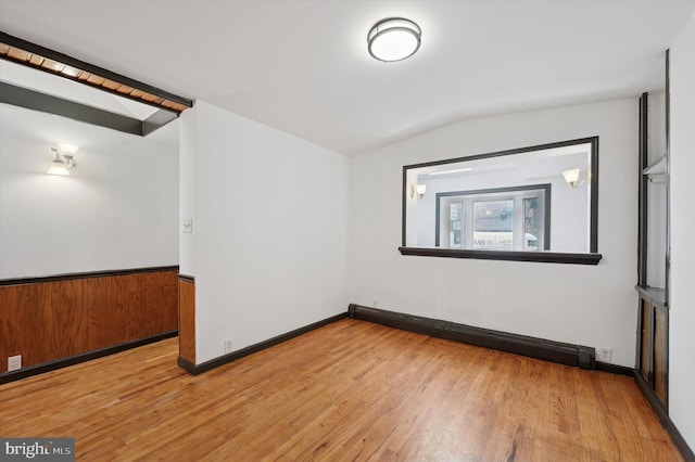 913 Tasker St, Philadelphia, PA 19148 - empty room featuring lofted ceiling, wood finished floors, and baseboards