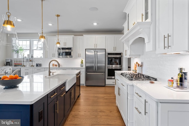 18234 Highwood Dr, Rehoboth Beach, DE 19971 - kitchen with stainless steel appliances, a sink, light countertops, backsplash, and recessed lighting