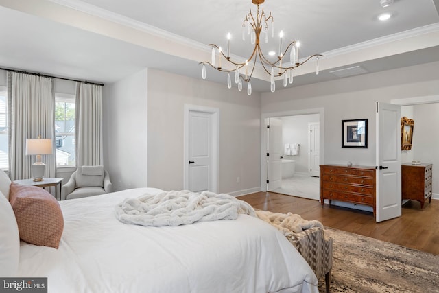 18234 Highwood Dr, Rehoboth Beach, DE 19971 - bedroom with a chandelier, wood finished floors, crown molding, baseboards, and connected bathroom