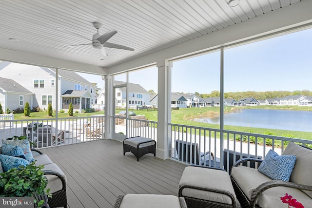 18234 Highwood Dr, Rehoboth Beach, DE 19971 - sunroom / solarium with ceiling fan, a residential view, and a water view