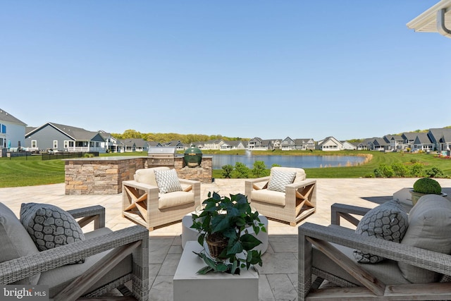 18234 Highwood Dr, Rehoboth Beach, DE 19971 - view of patio with an outdoor living space, a residential view, area for grilling, and a water view