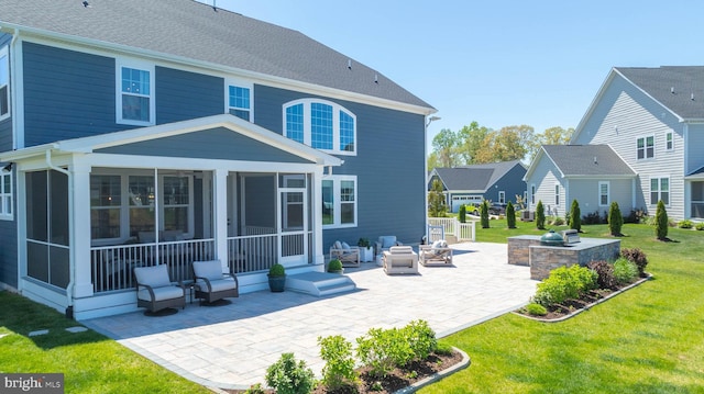 18234 Highwood Dr, Rehoboth Beach, DE 19971 - rear view of property featuring a sunroom, a patio area, and a lawn