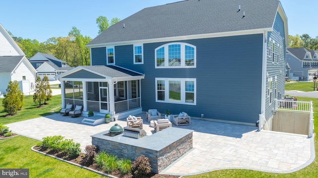 18234 Highwood Dr, Rehoboth Beach, DE 19971 - rear view of property with a sunroom, a patio, a yard, a fire pit, and roof with shingles